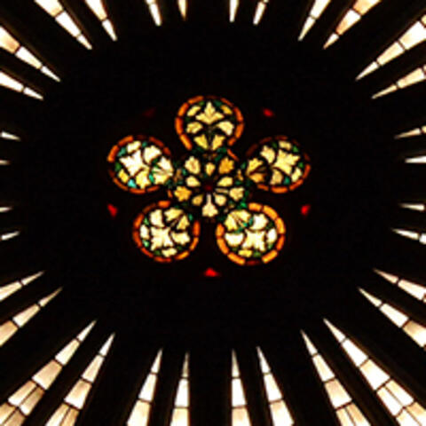A circular stained glass window in a French church